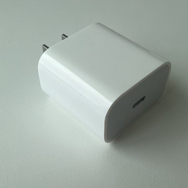 Apple 18W USB-C Power Adapter, model A1720, front view with a single USB-C port.