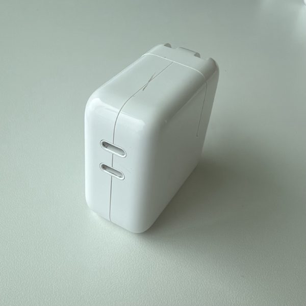 Apple 35W Dual USB-C Port Compact Power Adapter, model A2676, front view with two USB-C ports.