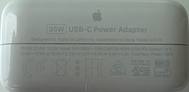 35W USB-C Power Adapter. Designed by Apple in California, Assembled in China. Model A2676. 35.0W 27.0W 15.0W. Input 100-240V~ 1.0A 50-60Hz. USB PD Output 1 or 2: 20.0V at 1.75A, or 15.0V at 2.33A, or 9.0V at 3.0A, or 5.0V at 3.0A. Total Max Power 35W. EMC 4084. Flextronics.