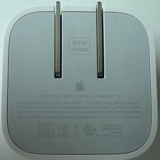 40W to 60W Dynamic Power Adapter. Designed by Apple in California, Made in China. Model A3351. Input 100-240V~ 50-60Hz 1.5A. USB PD Output: AVS 15.0-20.0V at 2.0A (3.0A DPS), or AVS 9.0-15.0V at 2.67A (3.0A DPS), or 9.0V at 3.0A, or 5.0V at 3.0A. Total Max Power 60W. EMC 8995. Salcomp Shenzhen.