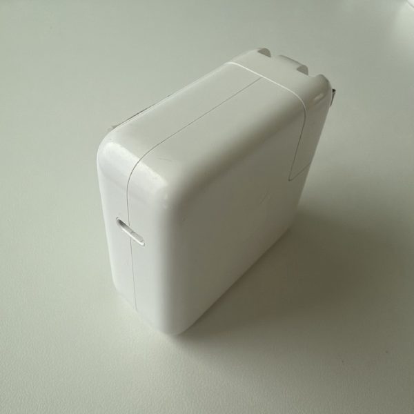 Apple 70W USB-C Power Adapter, model A2743, front view with a single USB-C port.