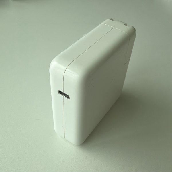Apple 87W USB-C Power Adapter, model A1719, with folding prongs.