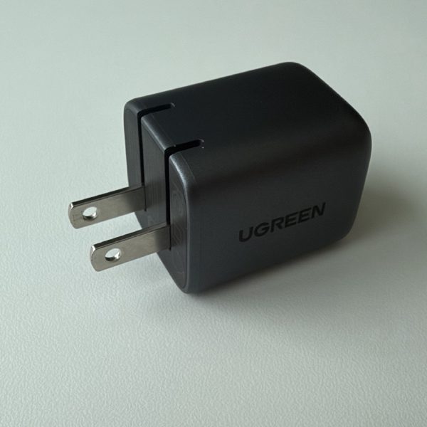 UGREEN 30W USB-C GaN Fast Charger in black, model CD319, with folding US prongs.